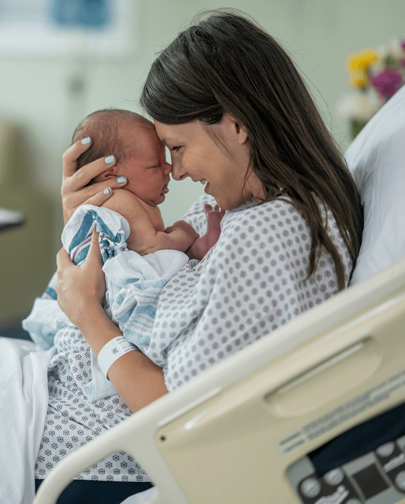 Mother holds baby