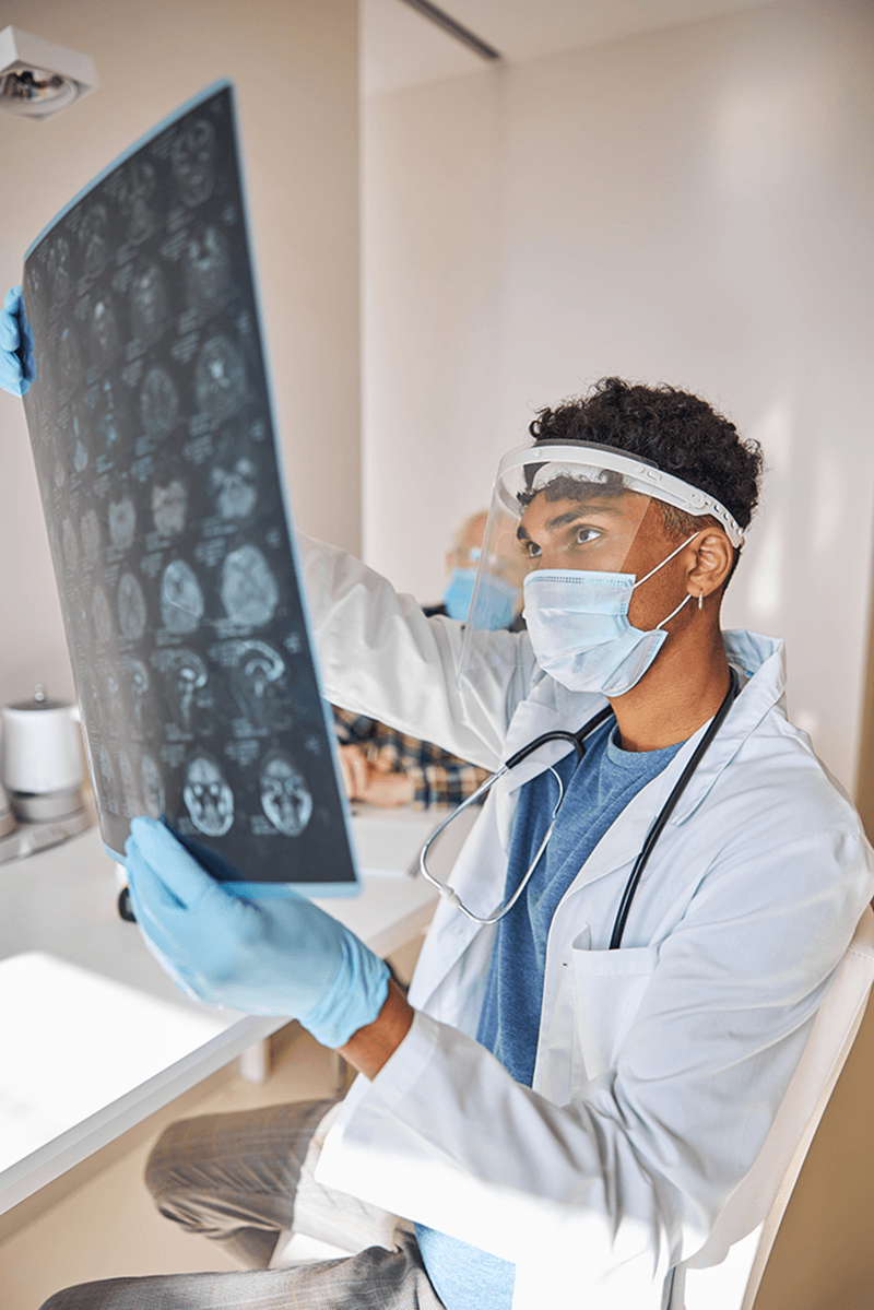 Doctor looking at brain scans