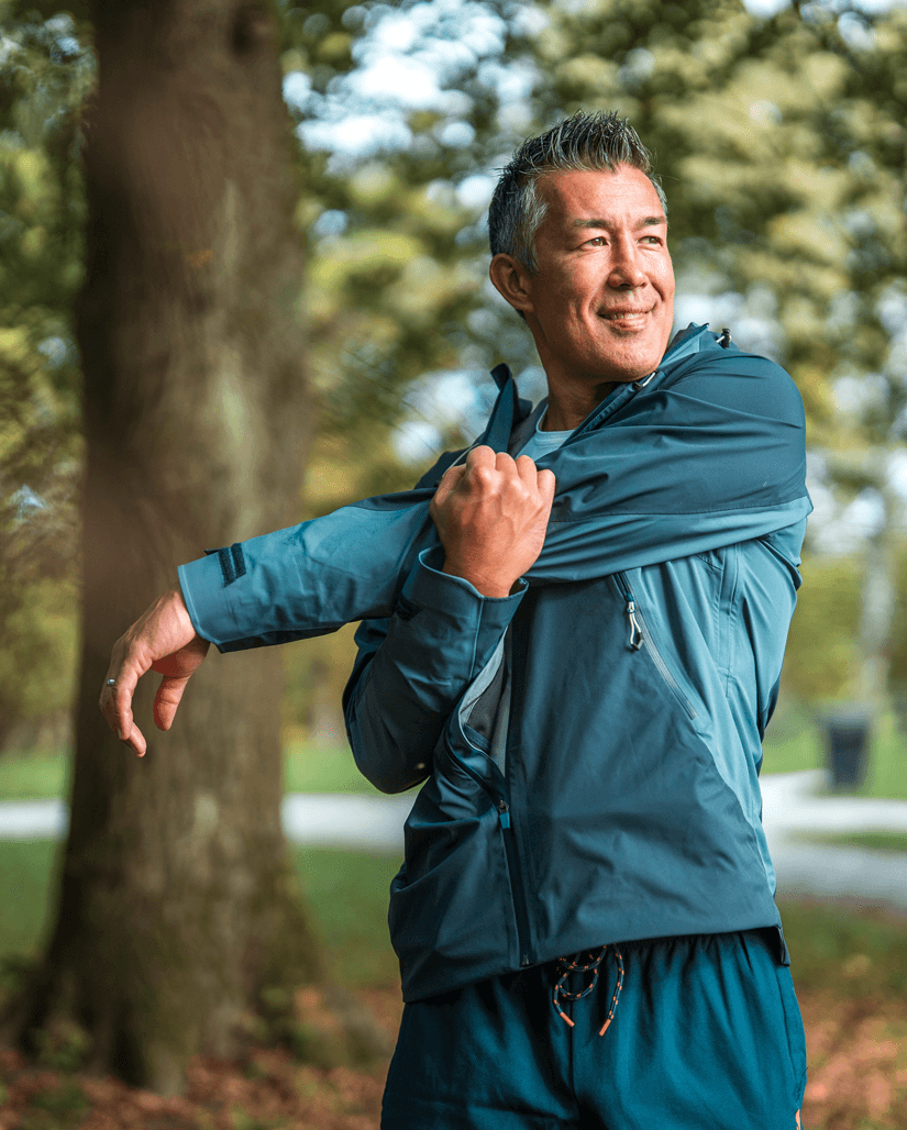 Man stretches in a park